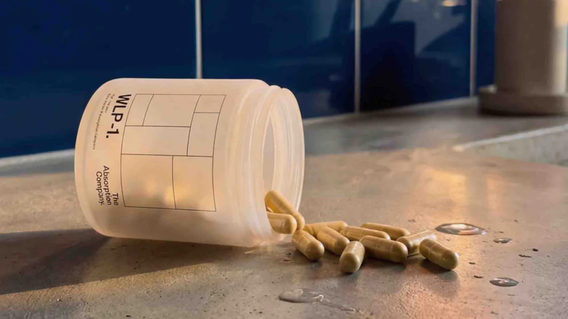 WLP-1 capsule bottle tipped over on a bathroom counter, with capsules spilling out.